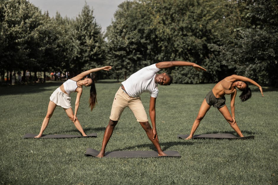 A diverse group of people comfortably relaxing on yoga mats.